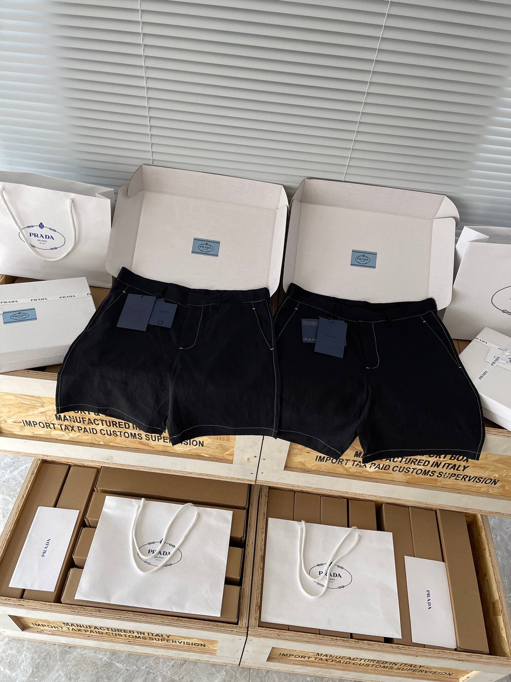 Prada black shorts, front view with zip fly, belt loops, two front pockets