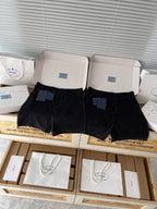 Prada black shorts, front view with zip fly, belt loops, two front pockets