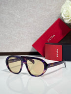 Prada glasses with tortoiseshell frames and light tinted lenses