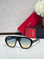 Prada glasses with black frames and amber-tinted lenses