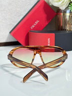 Prada glasses complete pair with tortoiseshell frame and tinted lenses