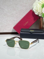 Cartier sunglasses with gold frames and green-tinted lenses