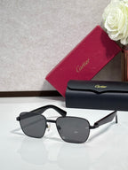 Cartier sunglasses with black frames and dark gray lenses