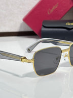 Cartier sunglasses close-up with gold frame and dark square lens