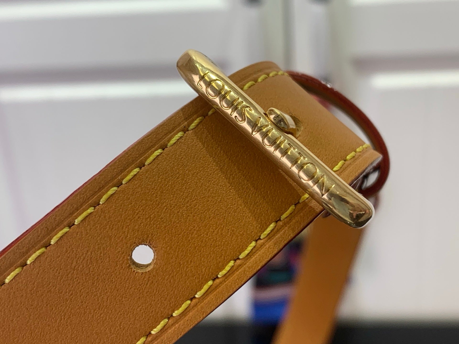 Louis Vuitton monogram bag leather strap end with gold clasp and stitched edge