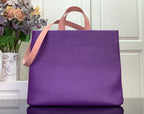 Purple tote bag with tan handles, front view