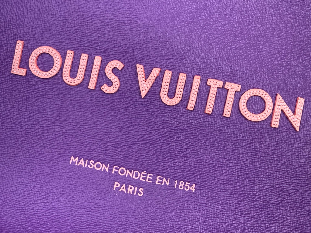 Purple bag logo close-up with Louis Vuitton lettering