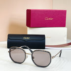 Cartier round sunglasses, dark gray frames with clear-tint lenses and silver-tone hardware
