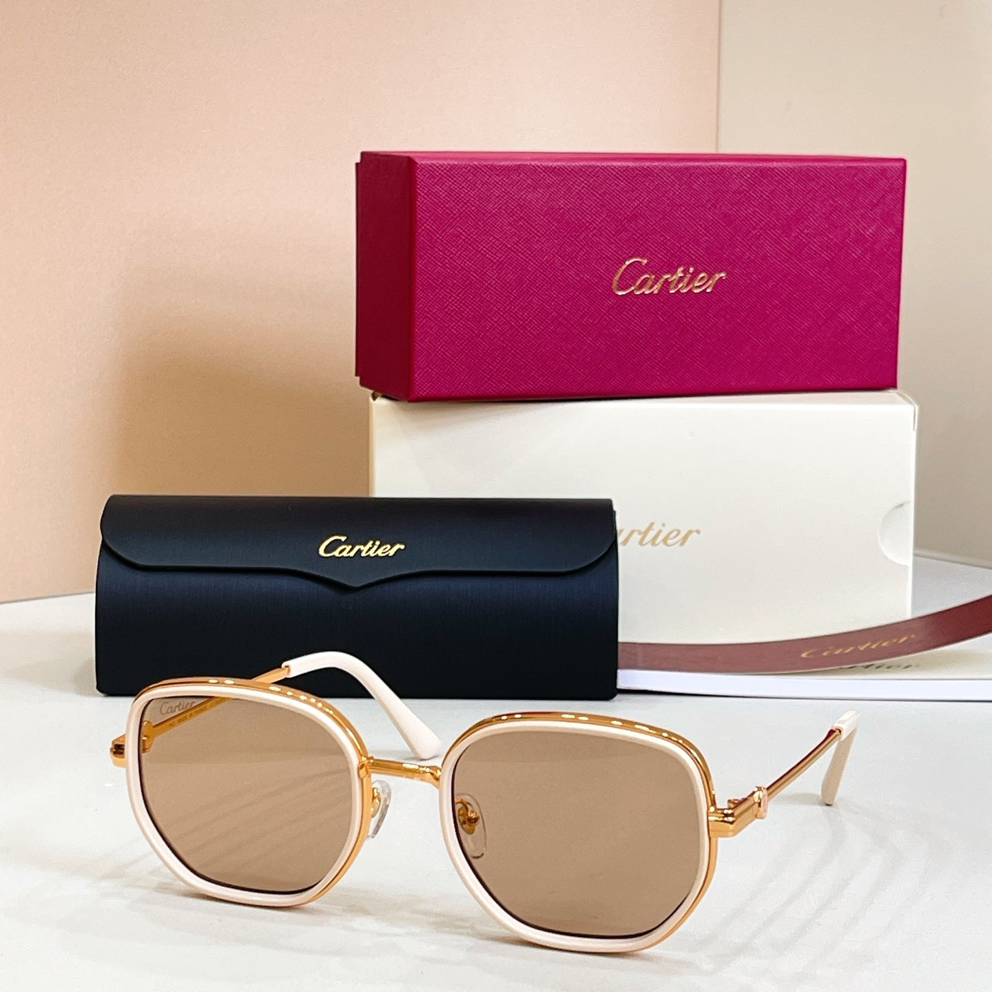Cartier round sunglasses, white frames with gold-tone rims and light tinted lenses
