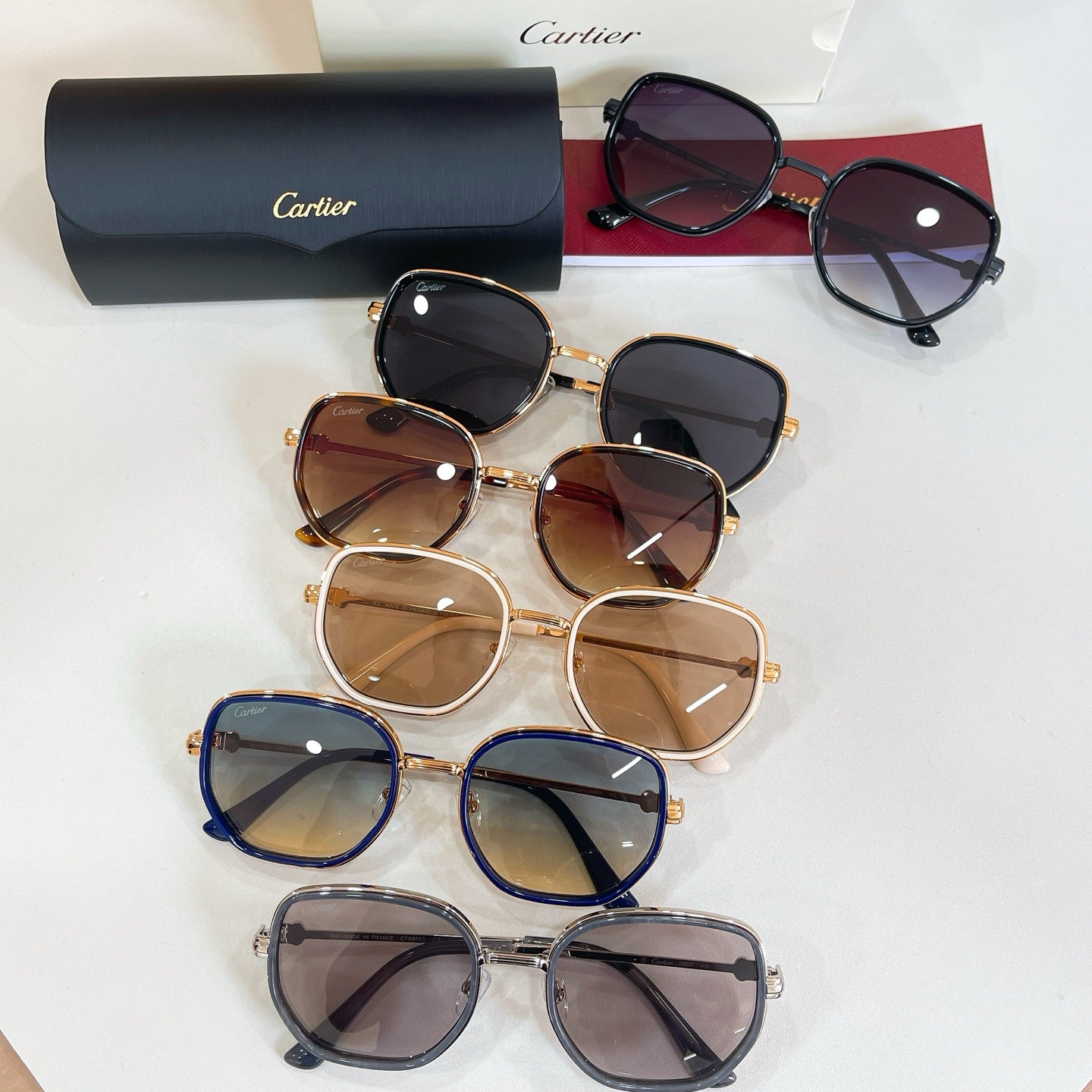 Cartier glasses assortment, multiple round sunglasses with mixed frame colors and tinted lenses