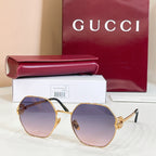 Gold round sunglasses with purple tinted lenses and gold-toned arms