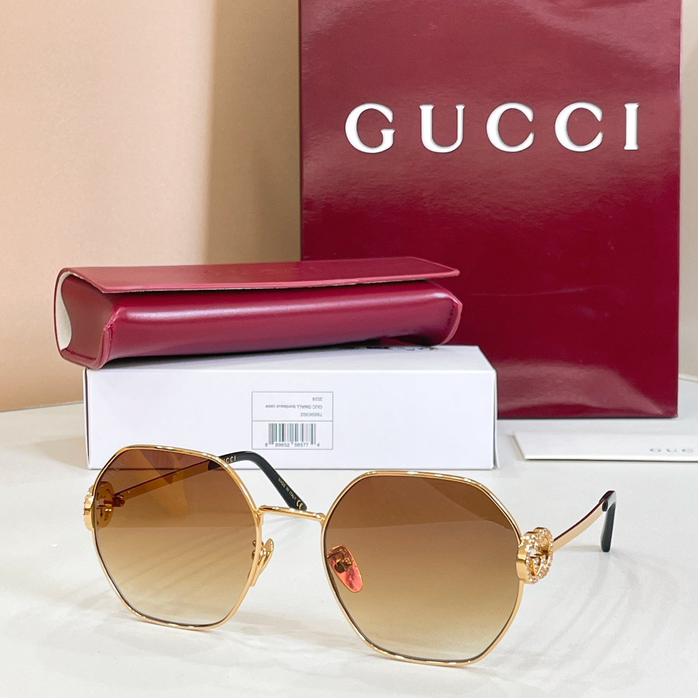 Gold round sunglasses with amber tinted lenses and gold-toned arms