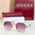 Gold round sunglasses with purple tinted lenses and black temple tips