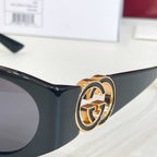 Gucci sunglasses temple with gold emblem hardware on black frame
