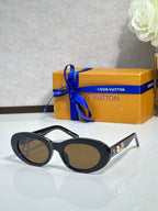 Louis Vuitton dark sunglasses with tortoise temples, gold logo studs, and tinted lenses