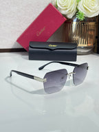 Cartier sunglasses with clear lenses and black frame, gold-tone hinges, front view