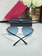 Cartier sunglasses with light blue lenses and black crossed temple arms, gold-tone accents