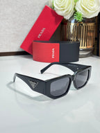 Prada sunglasses with black frames and smoked lenses