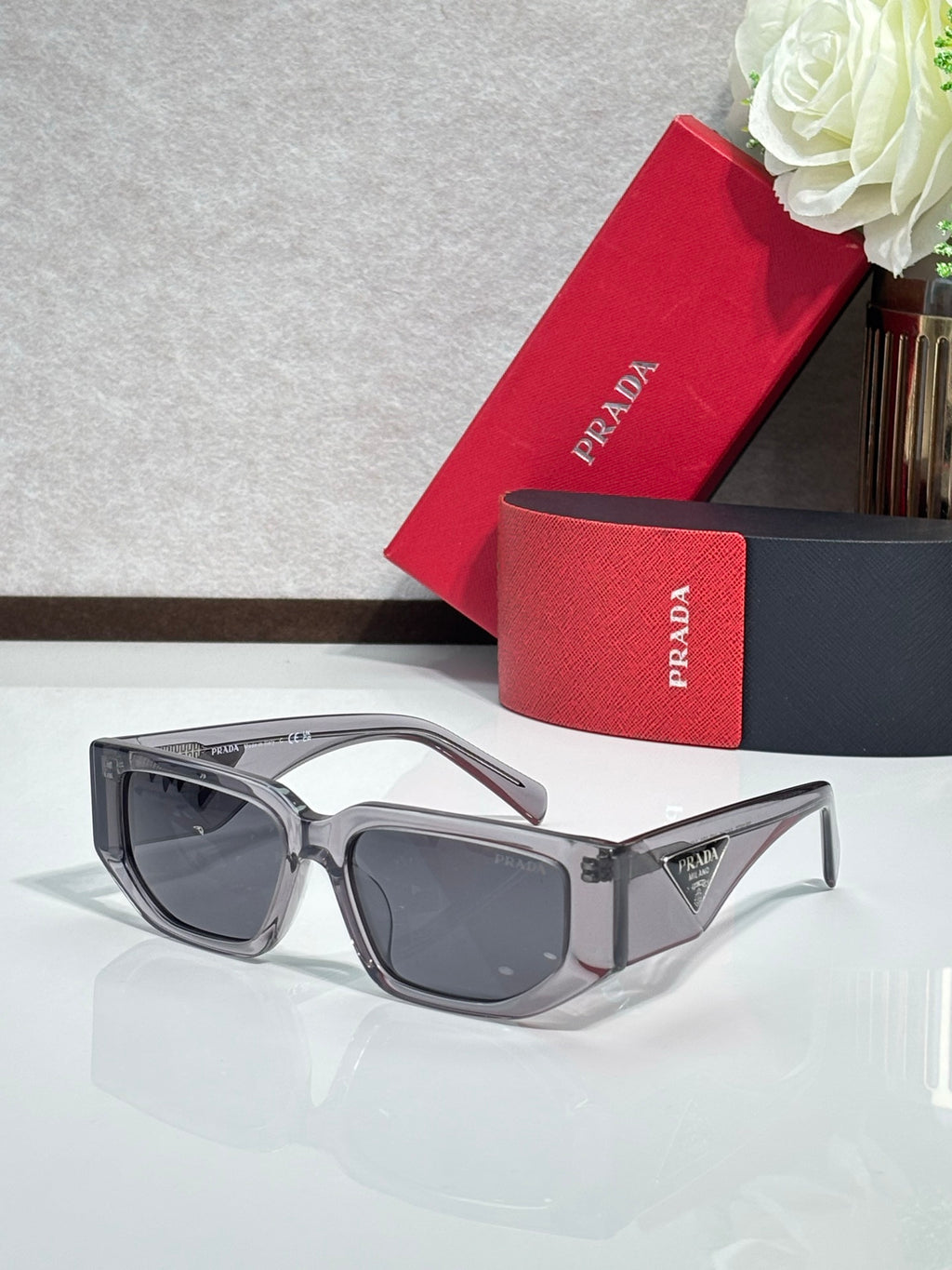 Prada sunglasses with gray frames and dark lenses