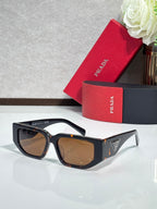 Prada sunglasses with black frames and brown-tinted lenses