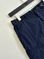 Navy cargo shorts front seam and pocket detail