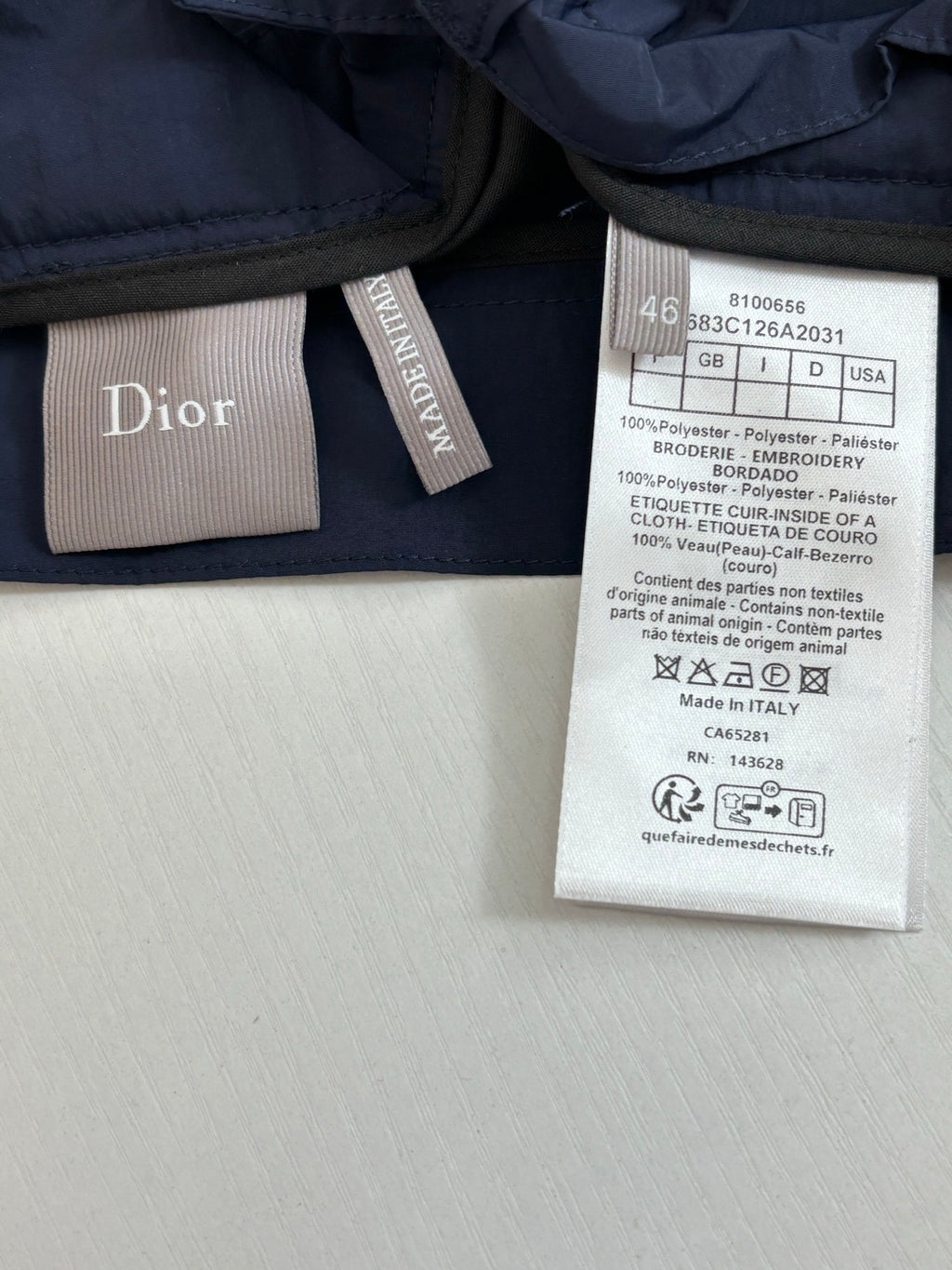 Navy cargo shorts care label and brand logo tag