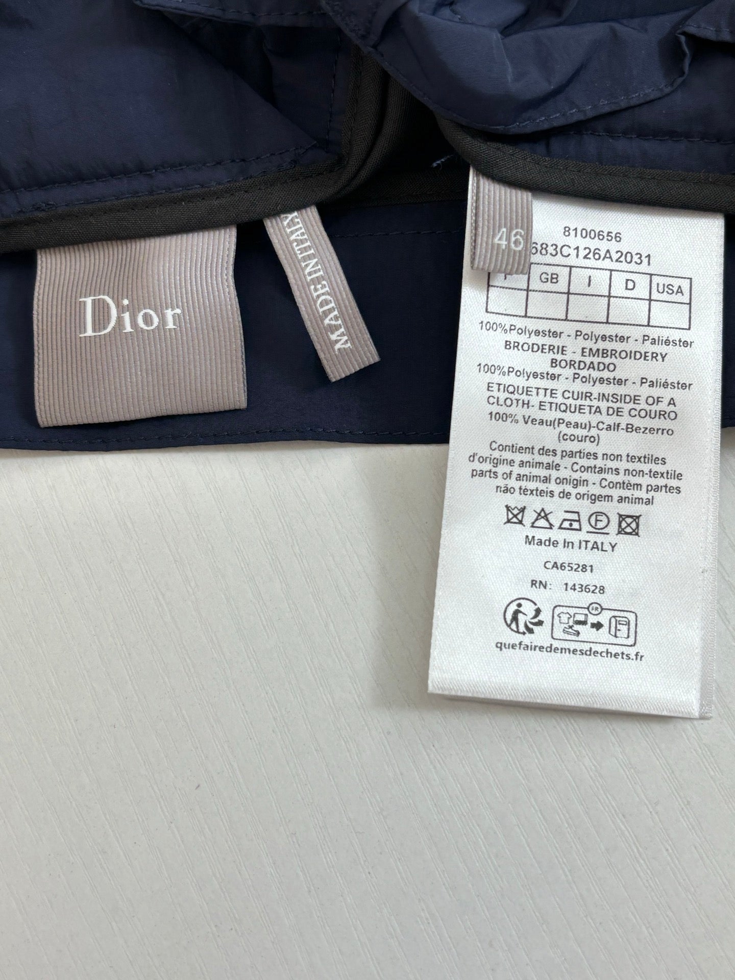 Navy cargo shorts care label and brand logo tag