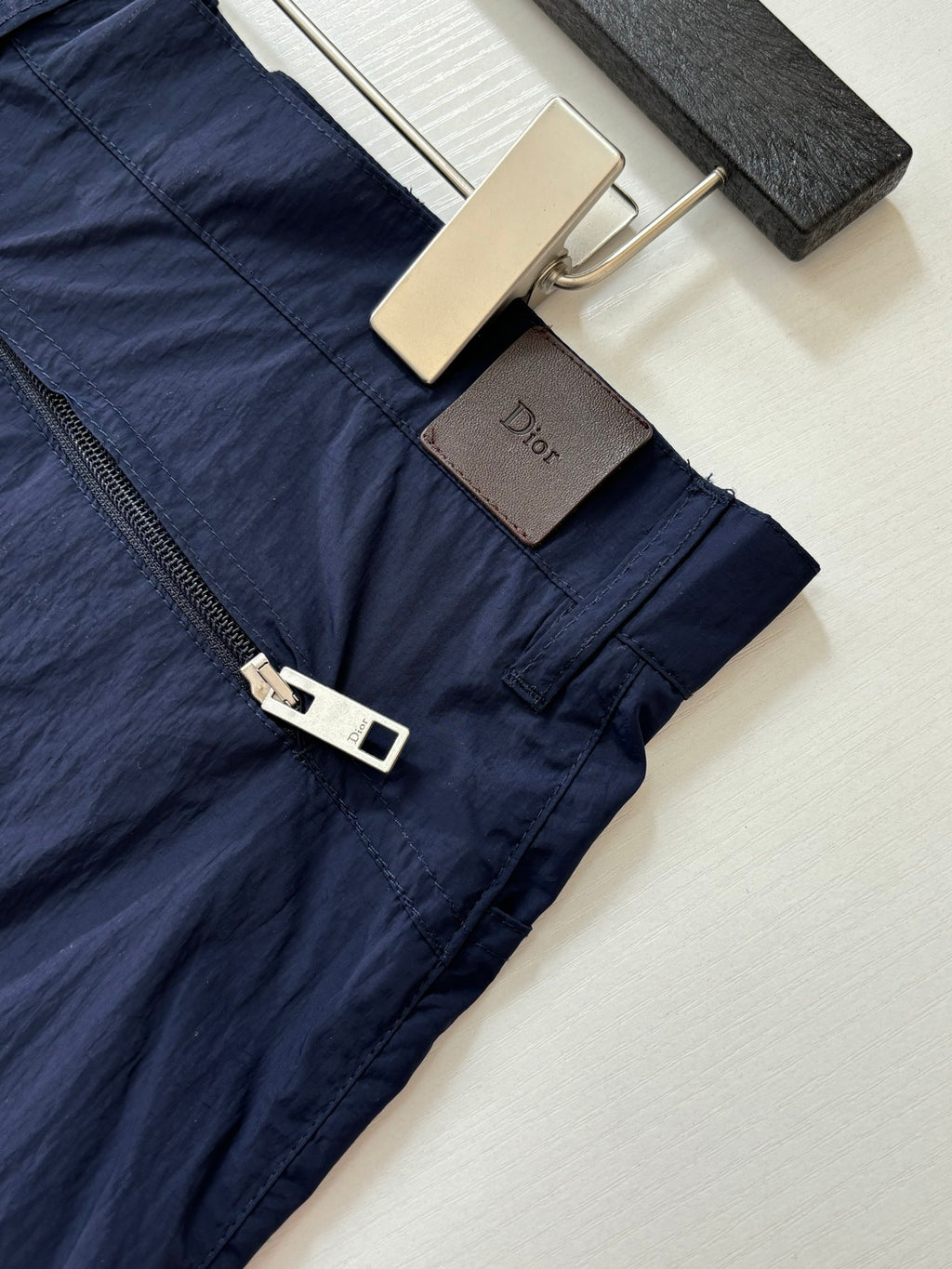 Navy cargo shorts with zipper fly and branded leather pull