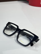 Black rectangular eyeglasses with clear lenses and glossy temple details