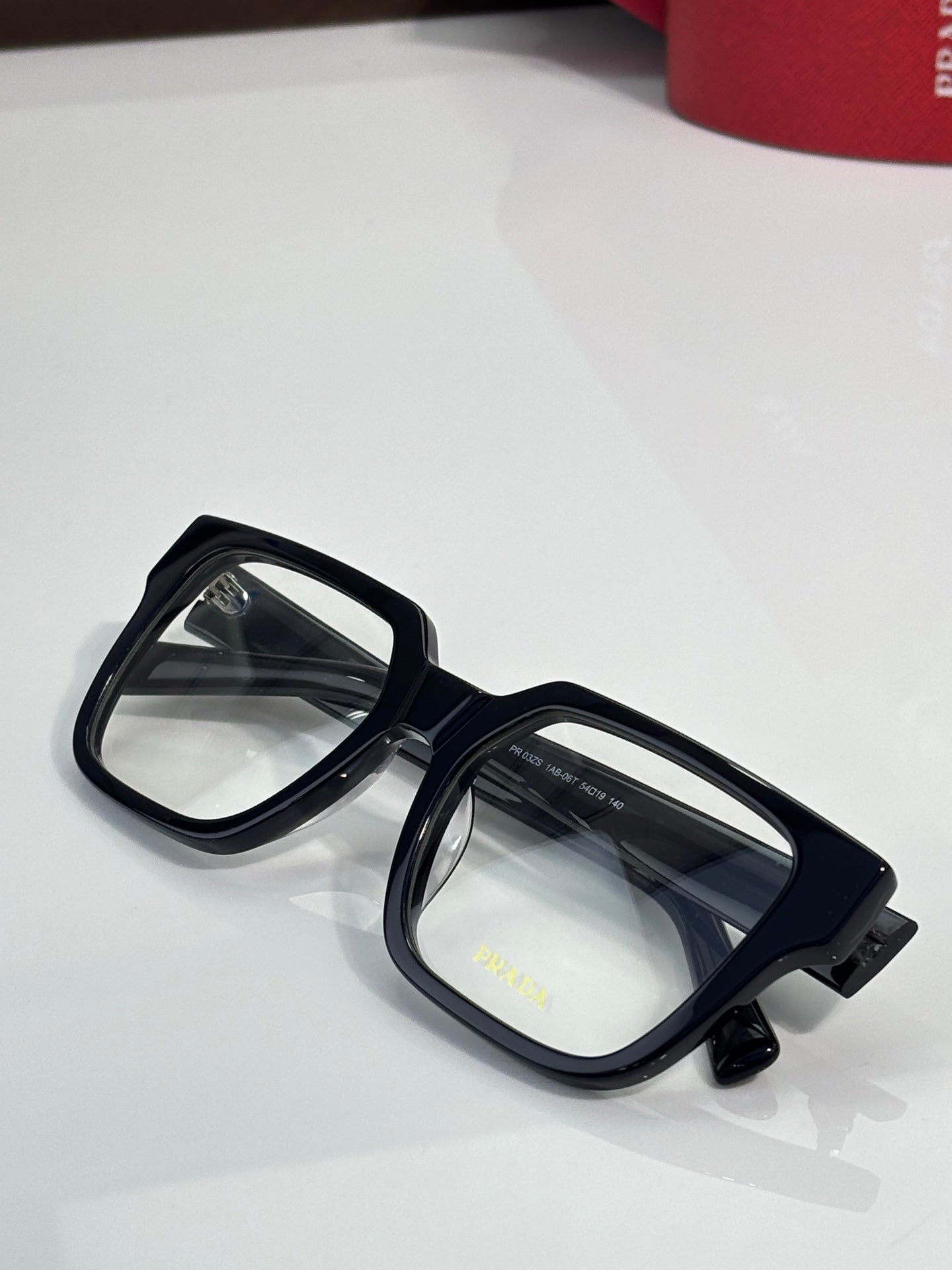 Black rectangular eyeglasses with clear lenses and glossy temple details