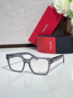 Gray rectangular eyeglasses with clear lenses and logo on temple