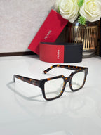 Tortoise and black rectangular eyeglasses with clear lenses