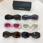 Multi-pack of oval sunglasses in black, pink, white, and tortoiseshell with tinted lenses