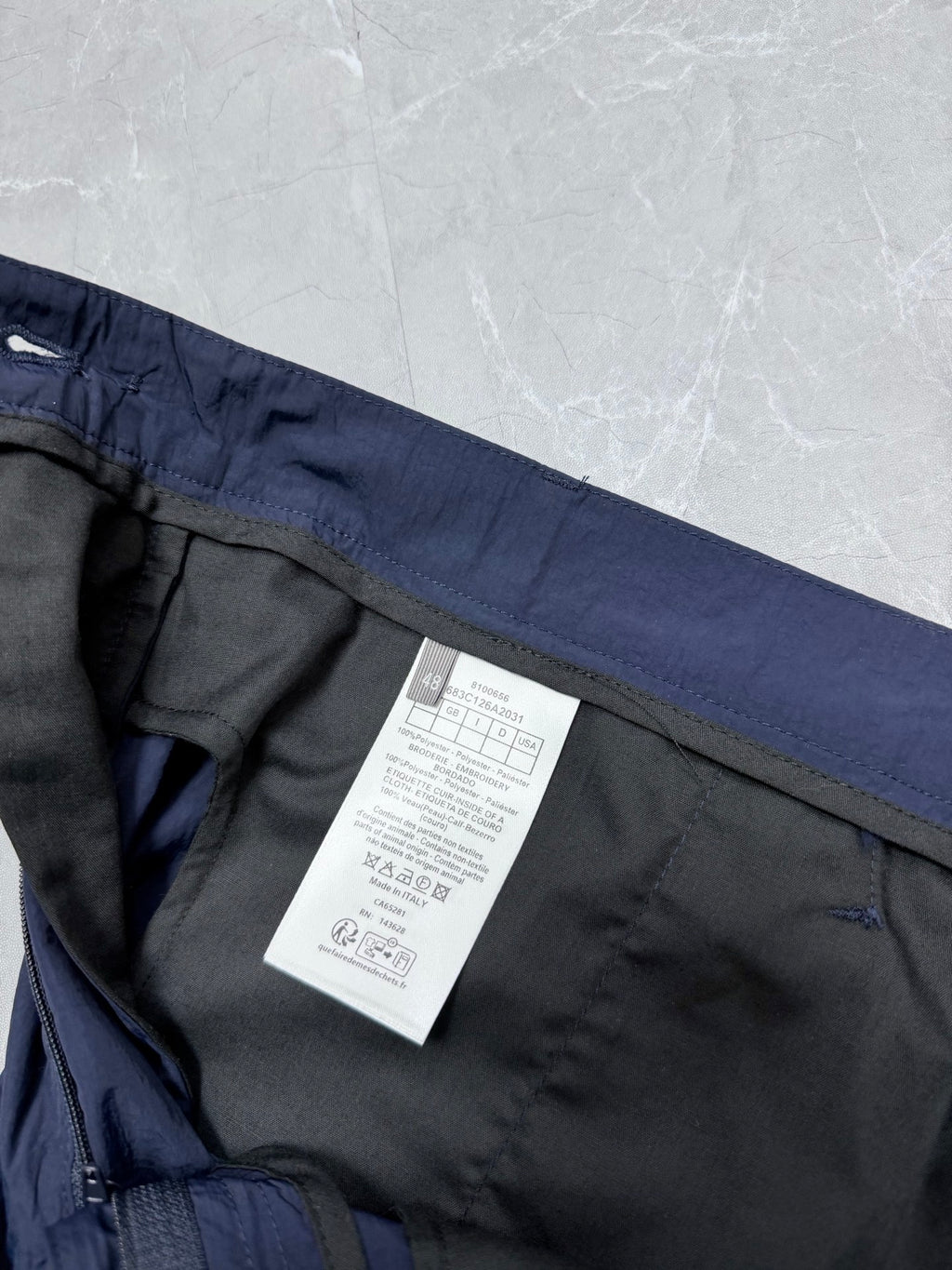 Dior navy shorts interior view with side seam and size/care label