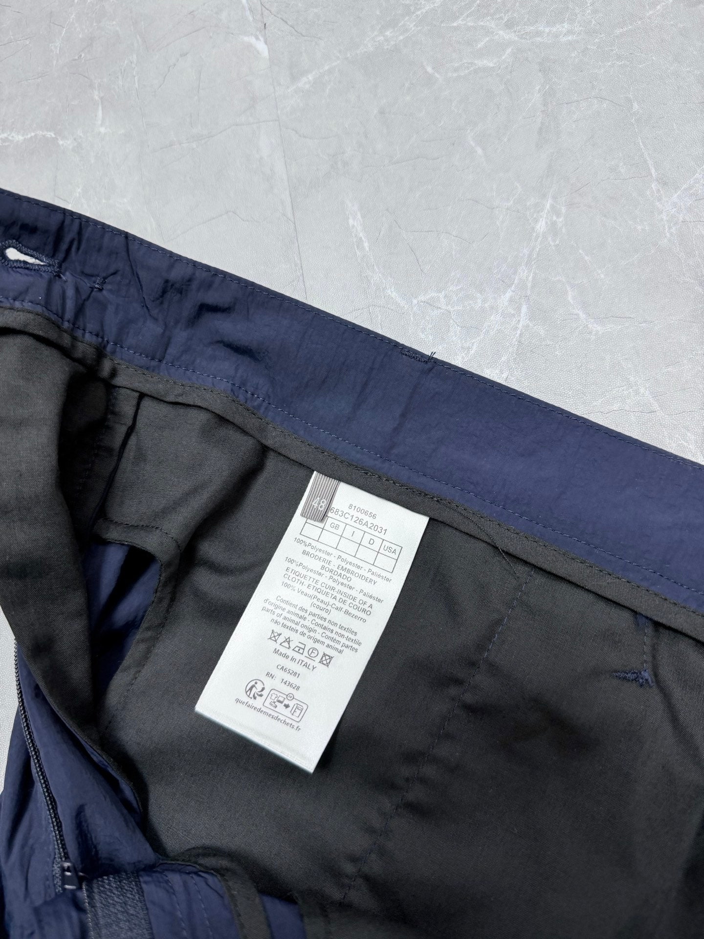 Dior navy shorts interior view with side seam and size/care label
