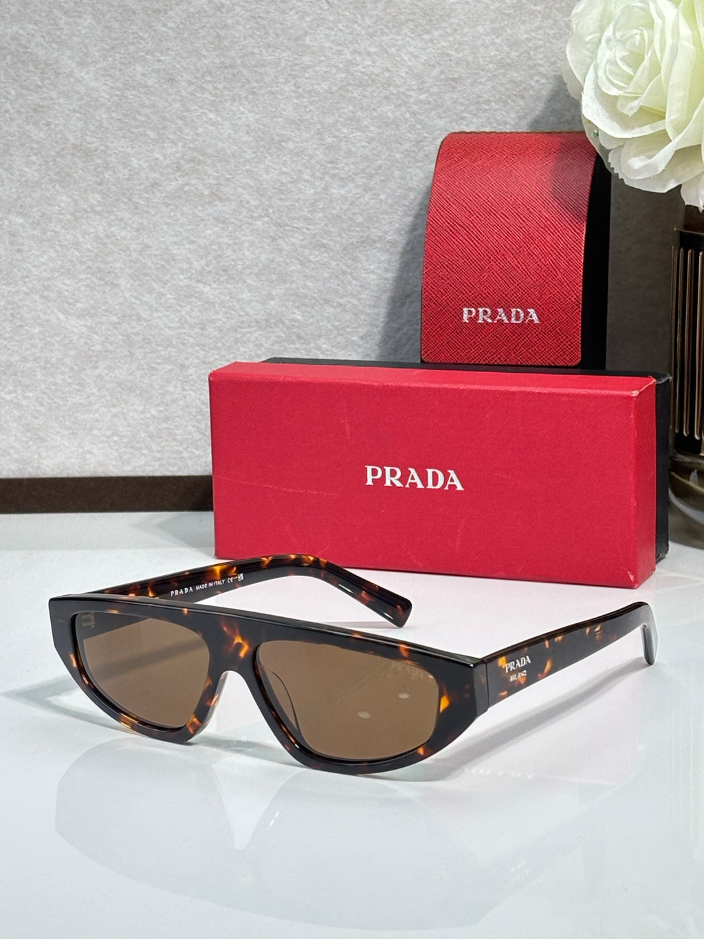 Prada sunglasses with tortoise frames and brown lenses
