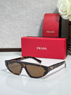 Prada sunglasses with tortoise frames and brown lenses
