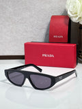 Prada sunglasses with black frames and dark gray lenses