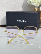 Gold-tone rectangular sunglasses with purple-tinted lenses and metal frame