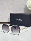 Celine round sunglasses with dark purple lenses and gold-tone metal frames