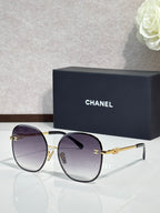 Celine round sunglasses with dark purple lenses and gold-tone metal frames