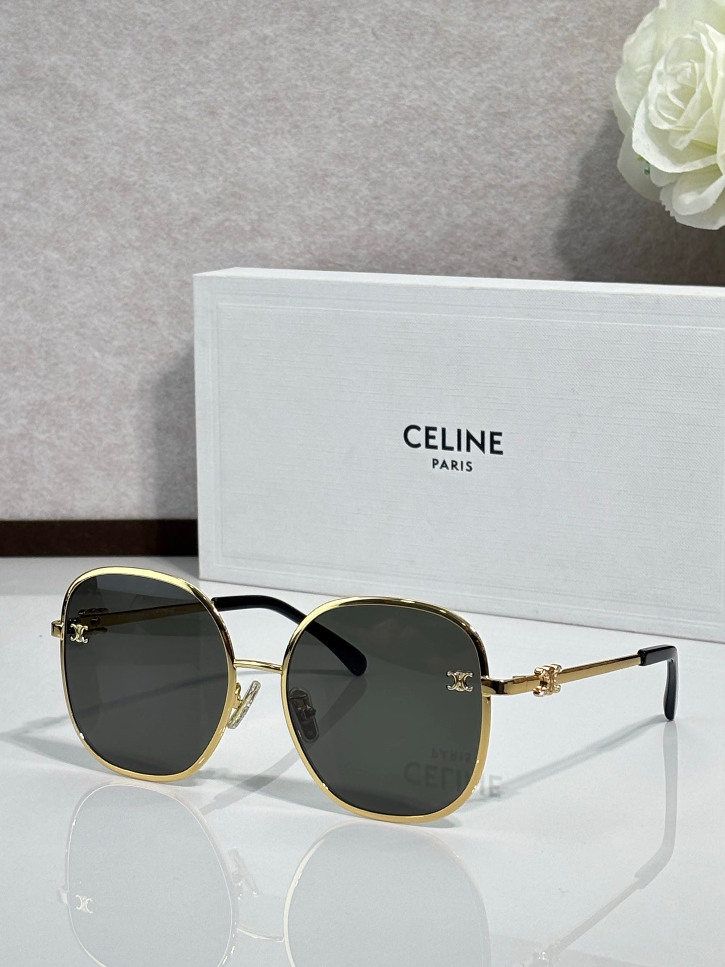 Celine round sunglasses with dark green lenses and gold-tone metal frames