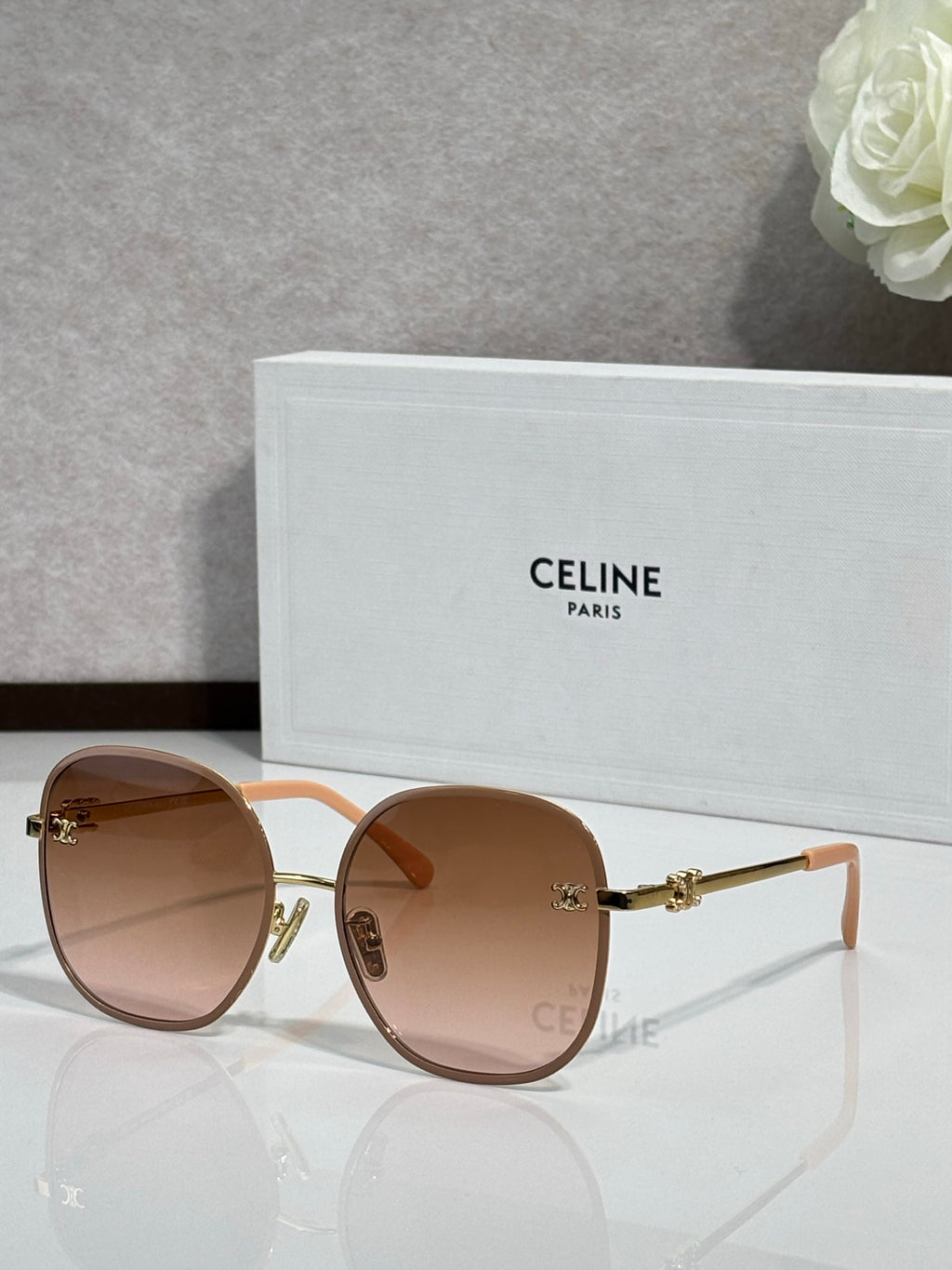 Celine round sunglasses with light brown lenses and gold-tone metal frames