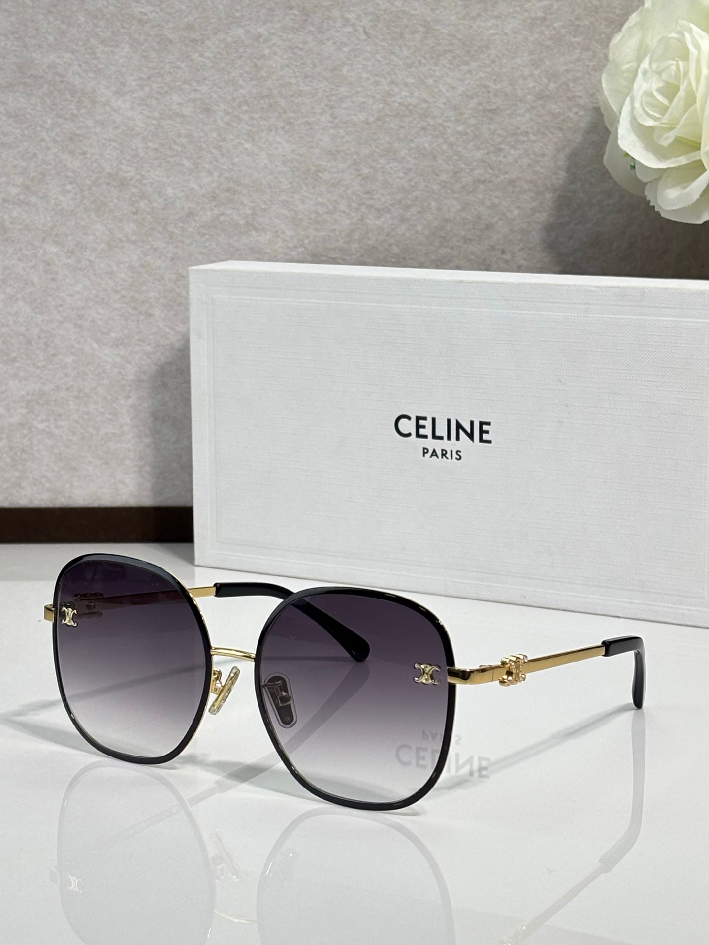Celine round sunglasses with deep purple lenses and gold-tone metal frames