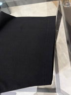 Black T-shirt hem with neat stitching detail