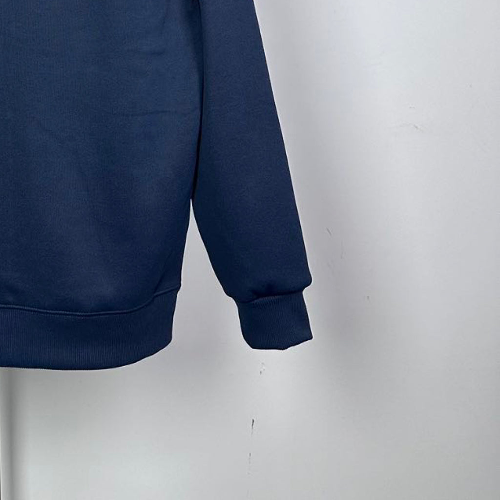 Dark blue crewneck sweatshirt sleeve with ribbed cuff