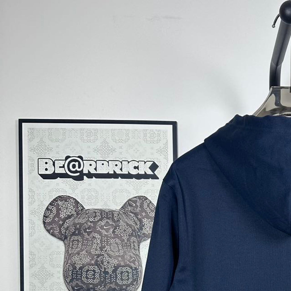 Dark navy hoodie back with hood, on hanger