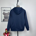 Dark navy zip hoodie, hooded back view on hanger