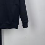Dark long-sleeve sweatshirt with ribbed cuffs and hem