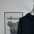 Dark zip-up hoodie hood and neckline with front zipper placket